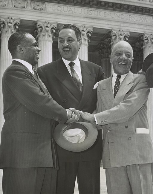 Three men in suits stand before a building with columns, smiling and shaking hands. The inscription "EQUAL JUSTICE UNDER LAW" appears above them, reflecting their commitment to self governance and mutual respect.