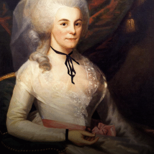 A woman in 18th-century attire sits on a chair, wearing a white lace dress with a pink ribbon belt and a black ribbon around her neck—an elegant portrait perfect for celebrating Women's History Month.