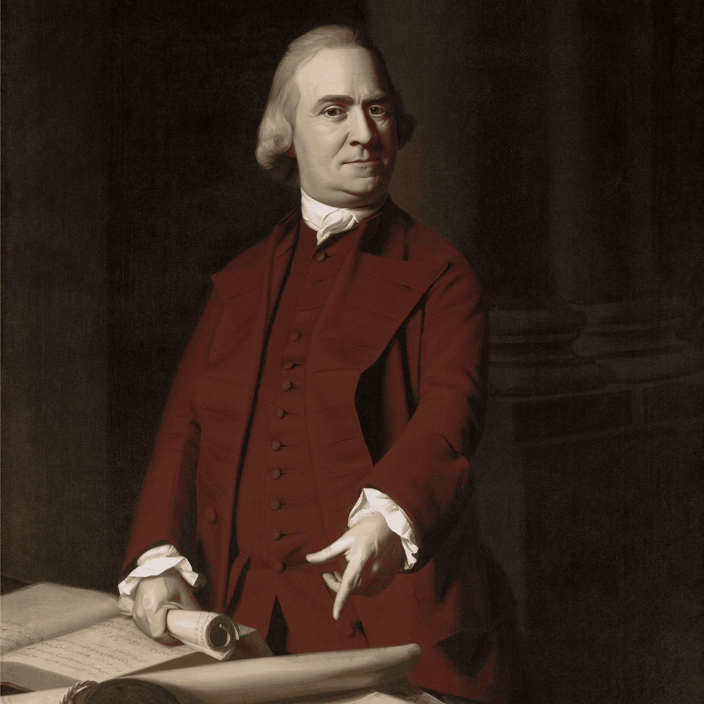 A man in 18th-century attire, evoking the spirit of America 250, stands beside a table with documents. He wears a red coat, white shirt, and waistcoat, holding a rolled paper and gesturing with his other hand against a dark, formal background.