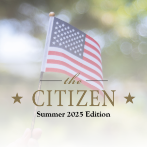 A hand holds a small American flag against a blurred outdoor background. Text overlays read: "The Citizen Summer 2025 Edition," with stars on either side of "Citizen," celebrating community spirit.