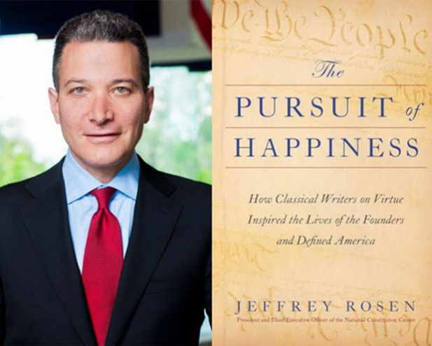 A man in a suit and red tie stands beside the cover of "The Pursuit of Happiness" by Jeffrey Rosen, a book exploring how classical writers on virtue influenced the Founders and helped shape the U.S. Constitution.