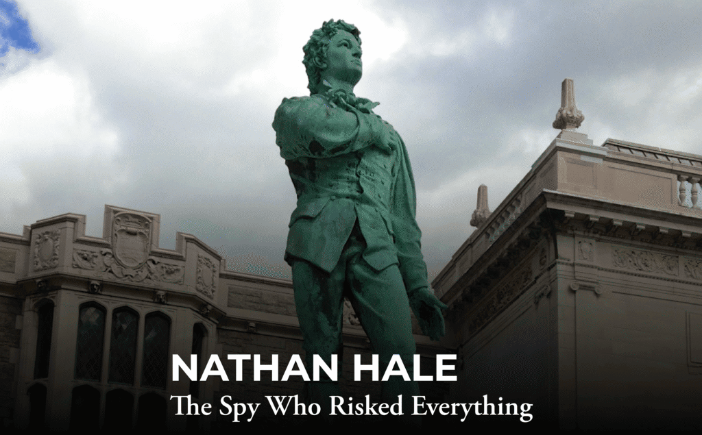 A bronze statue of Nathan Hale stands outside a historic building under a cloudy sky, with the text "NATHAN HALE: The Spy Who Risked Everything" overlaid at the bottom.