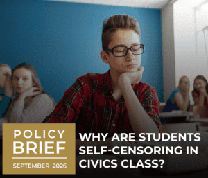 A student with glasses sits quietly in a classroom, appearing thoughtful, while other students look on. Text overlay reads, “Why are students self-censoring in civics class? Policy Brief September 2026.”.